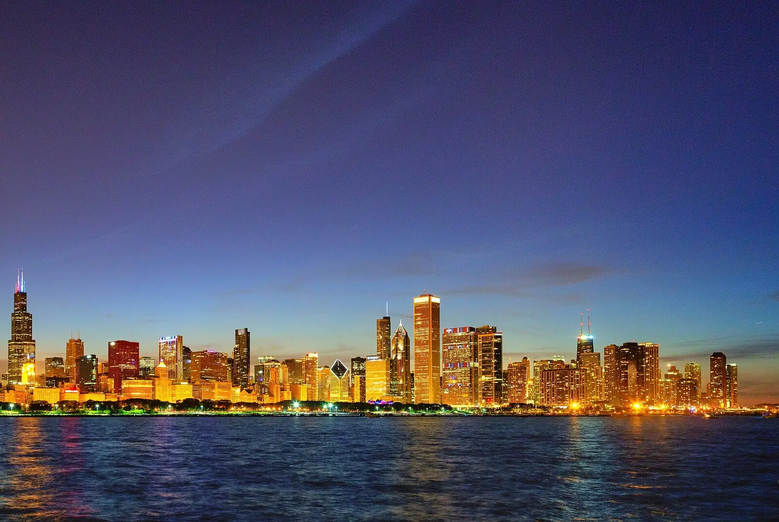 Chicago skyline at dusk across Lake Michigan